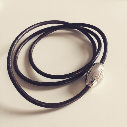 Leather necklace with rugby ball and black diamond