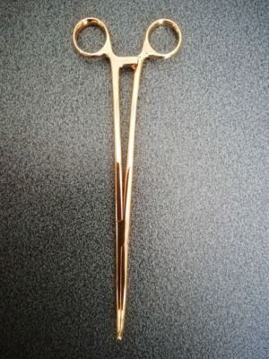 Pinze ginecologiche in oro giallo 750 