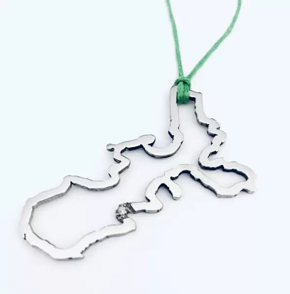 Ciondolo Silhouette Isola d'Elba in acciaio con diamante a Marina di Campo  