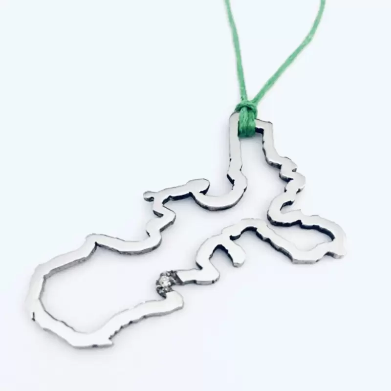 Pendentif Silhouette Île d'Elbe en acier avec diamant à Marina di Campo