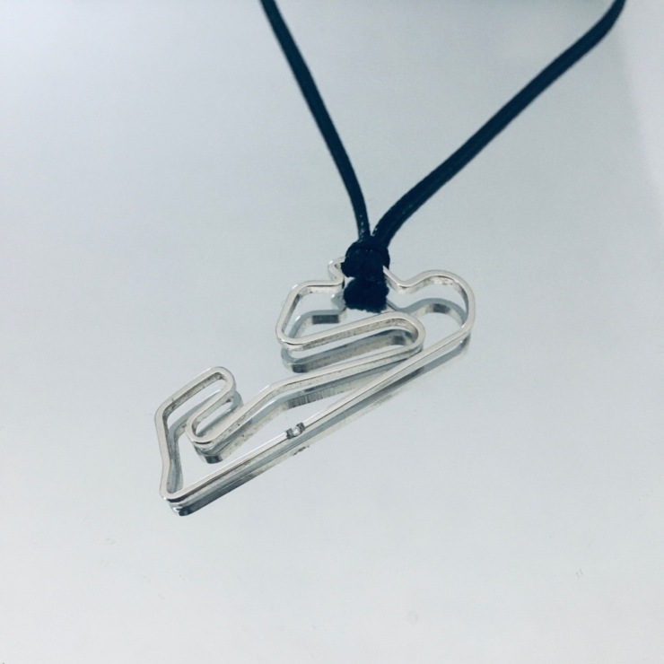 Estoril circuit pendant in stainless steel with diamond at the start