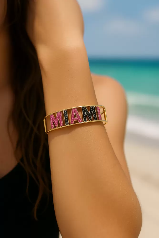 MIAMI rigid bracelet in 18kt yellow gold black diamonds and pink sapphires  