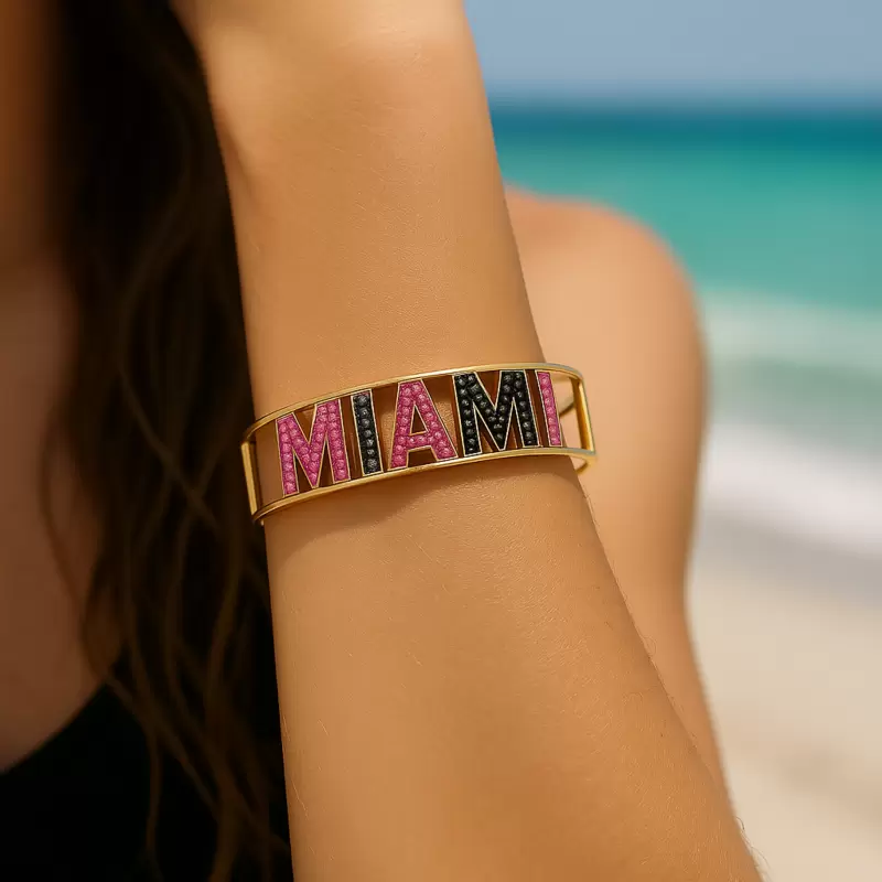 MIAMI rigid bracelet in 18kt yellow gold black diamonds and pink sapphires