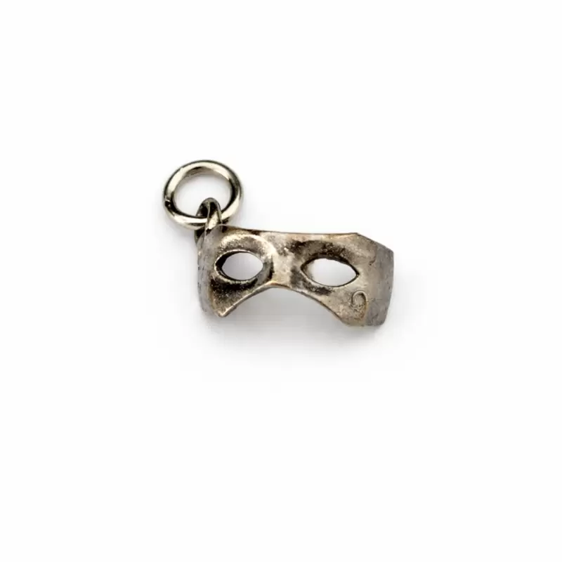 Osimhen mask charm in burnished bronze with embossed number 9